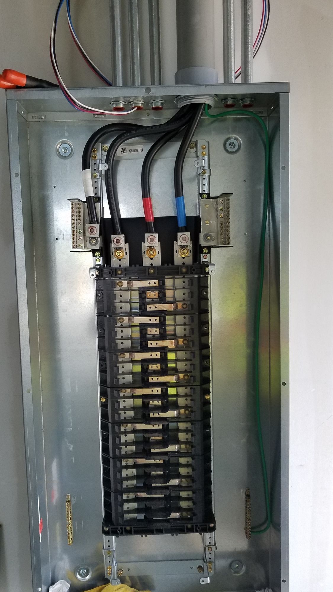 A close up of a electrical box with wires coming out of it.