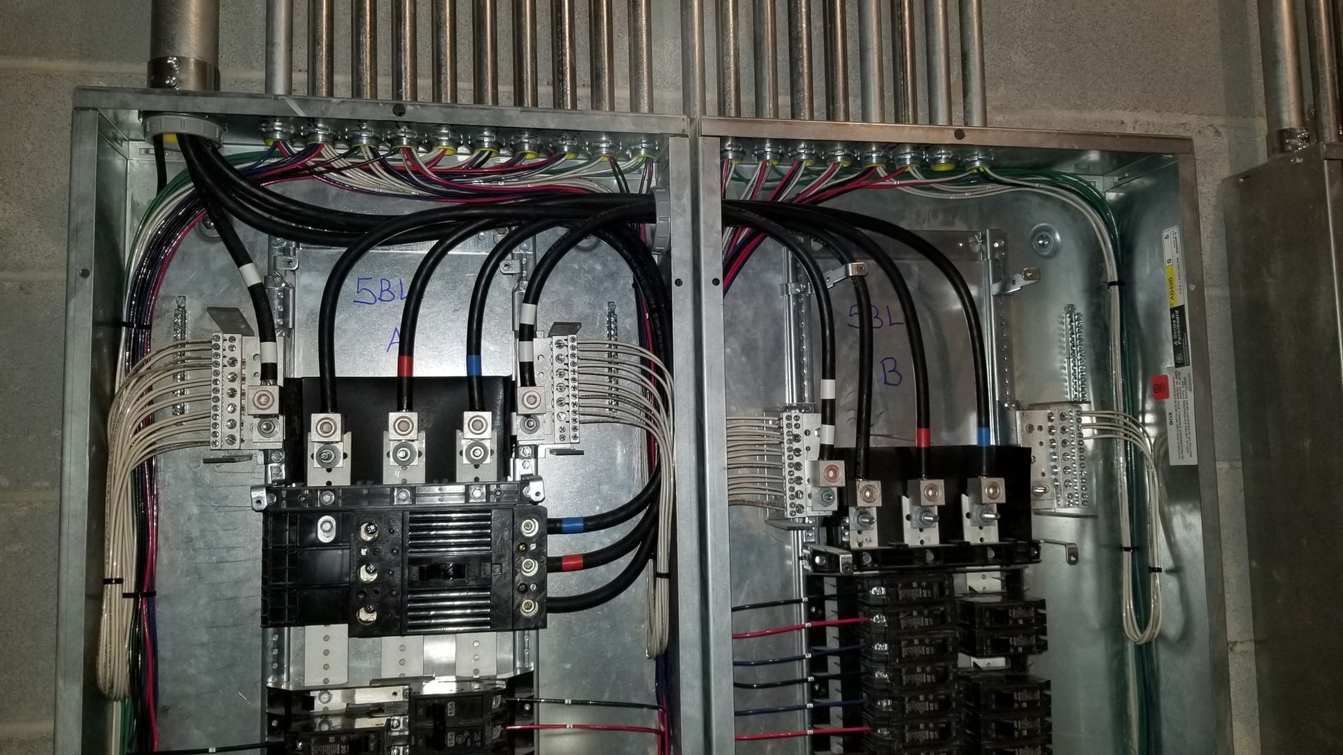 A electrical box with a lot of wires coming out of it