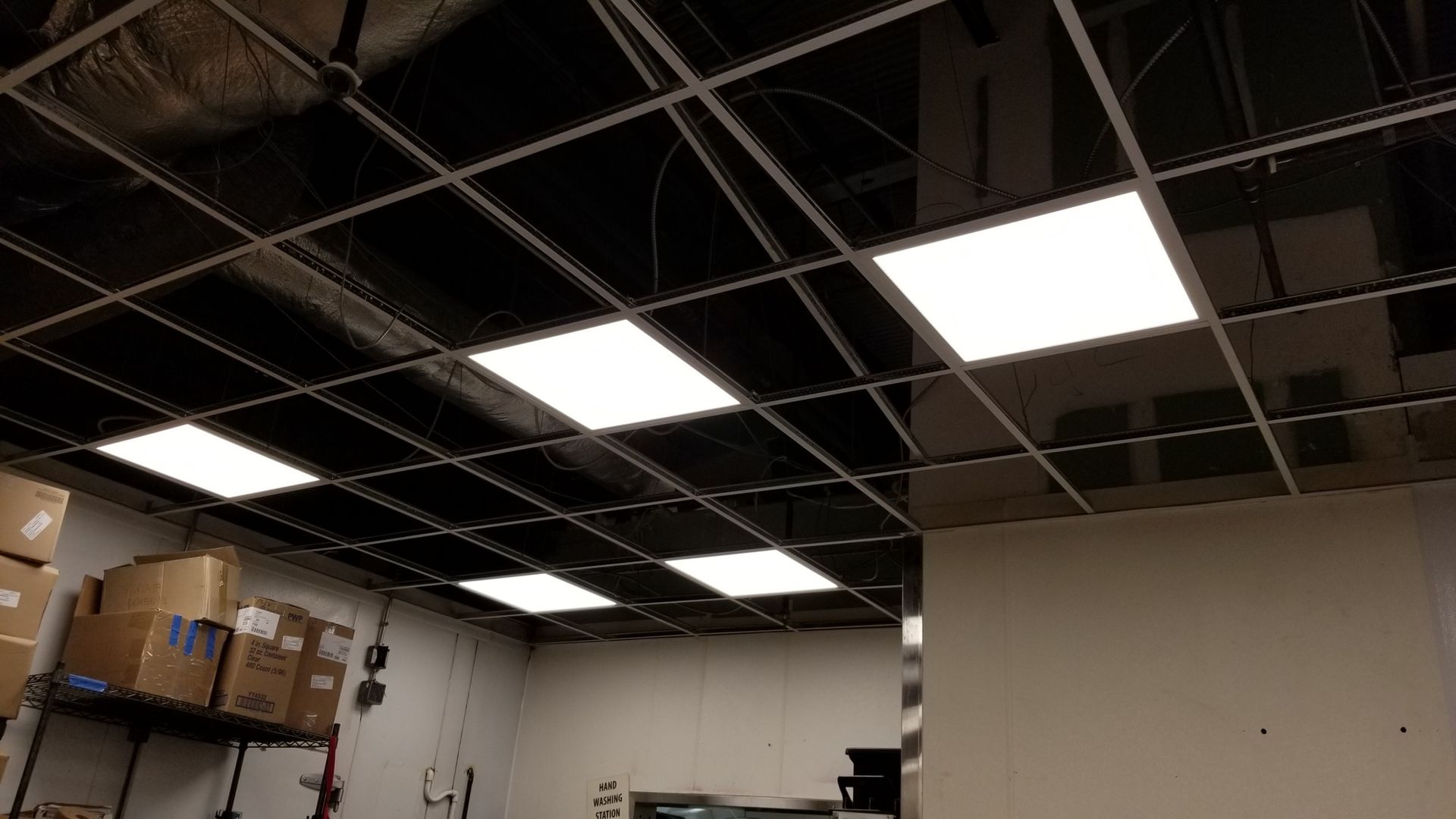 A room with a ceiling that has a lot of lights on it.