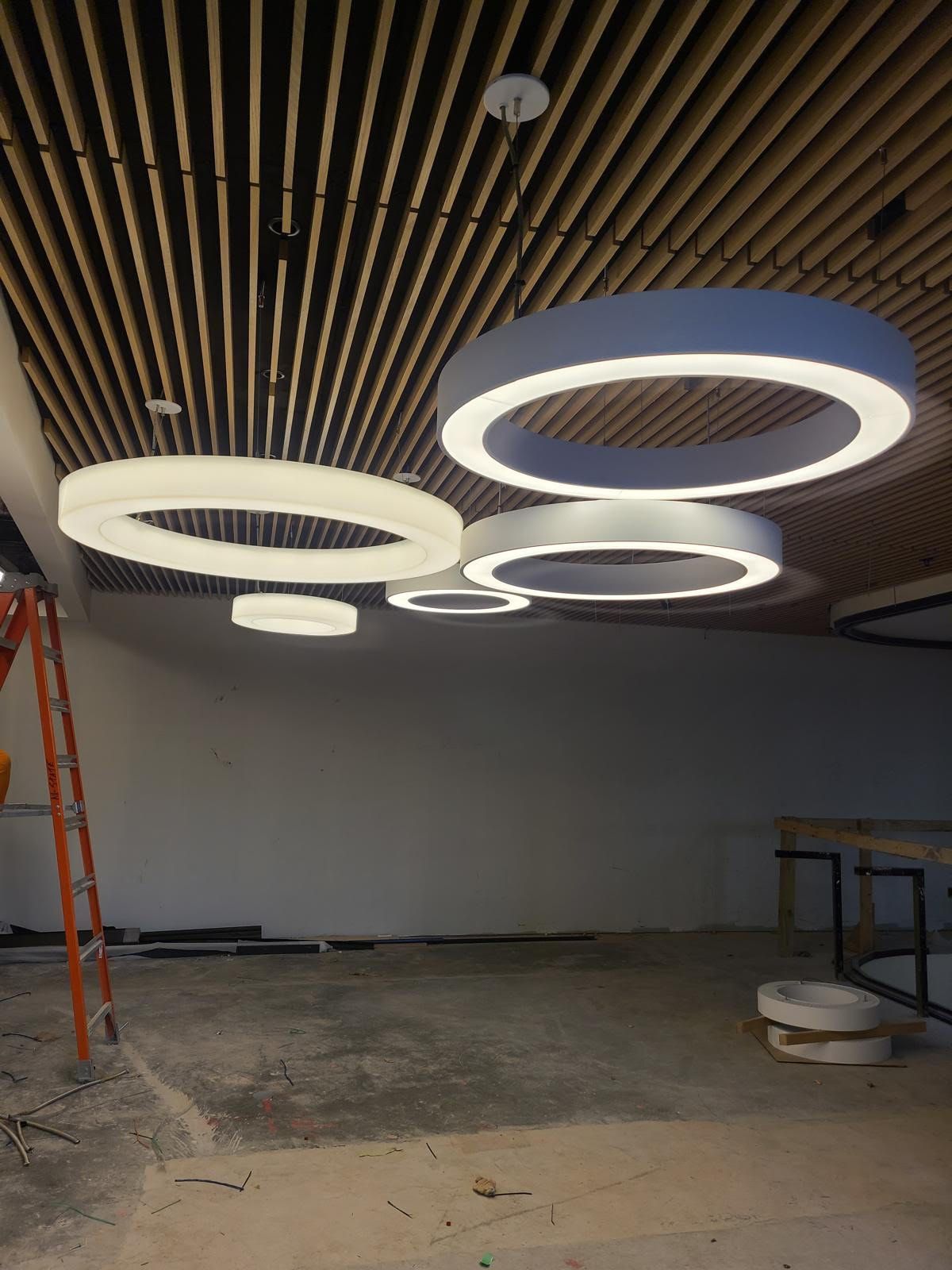 A ceiling with a lot of circles hanging from it