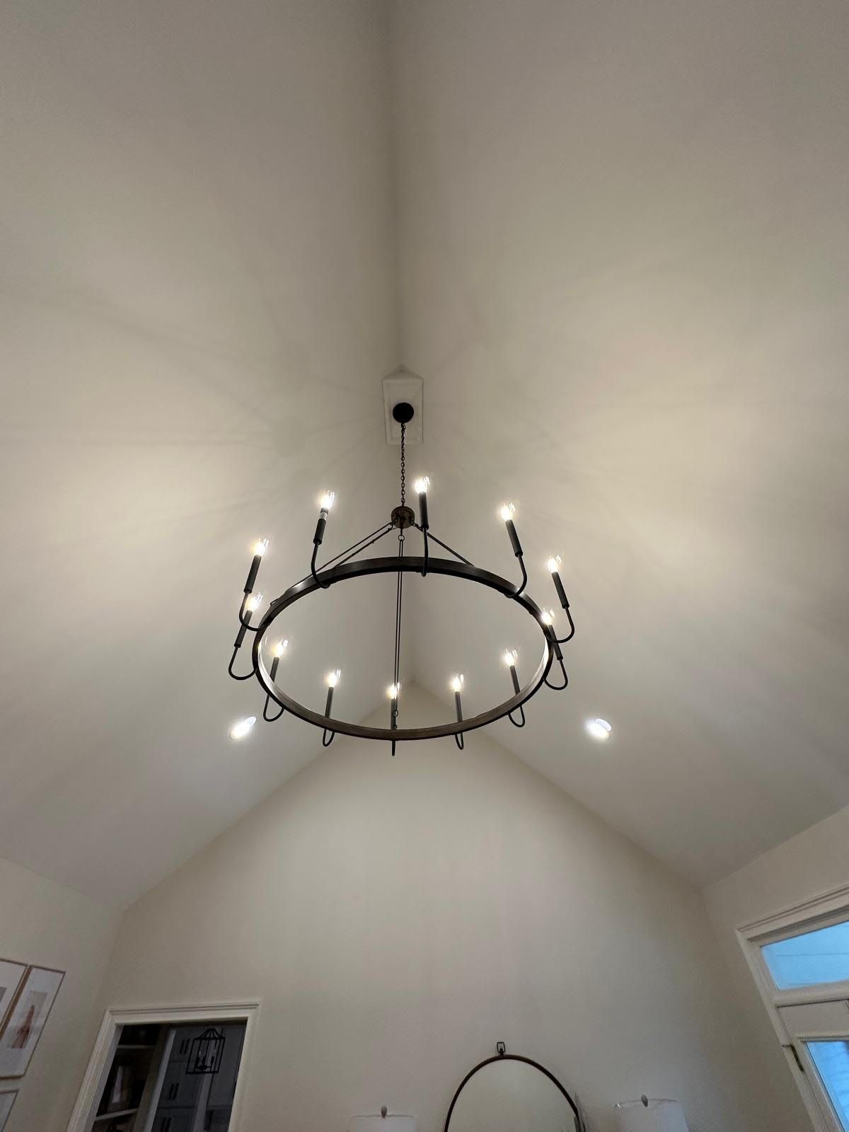 A chandelier is hanging from the ceiling of a room.