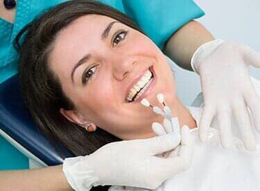 Smiling woman lying in a dental chair — Dental Office in Virginia Beach, VA