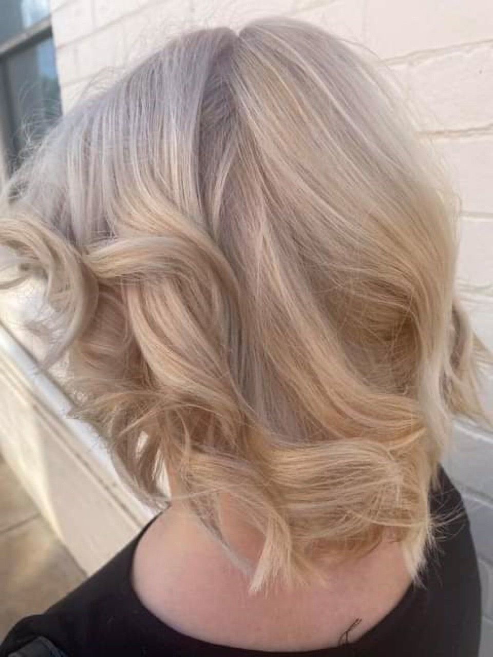 Blonde Curly Hairstyle — Hairstylists in Tamworth,NSW
