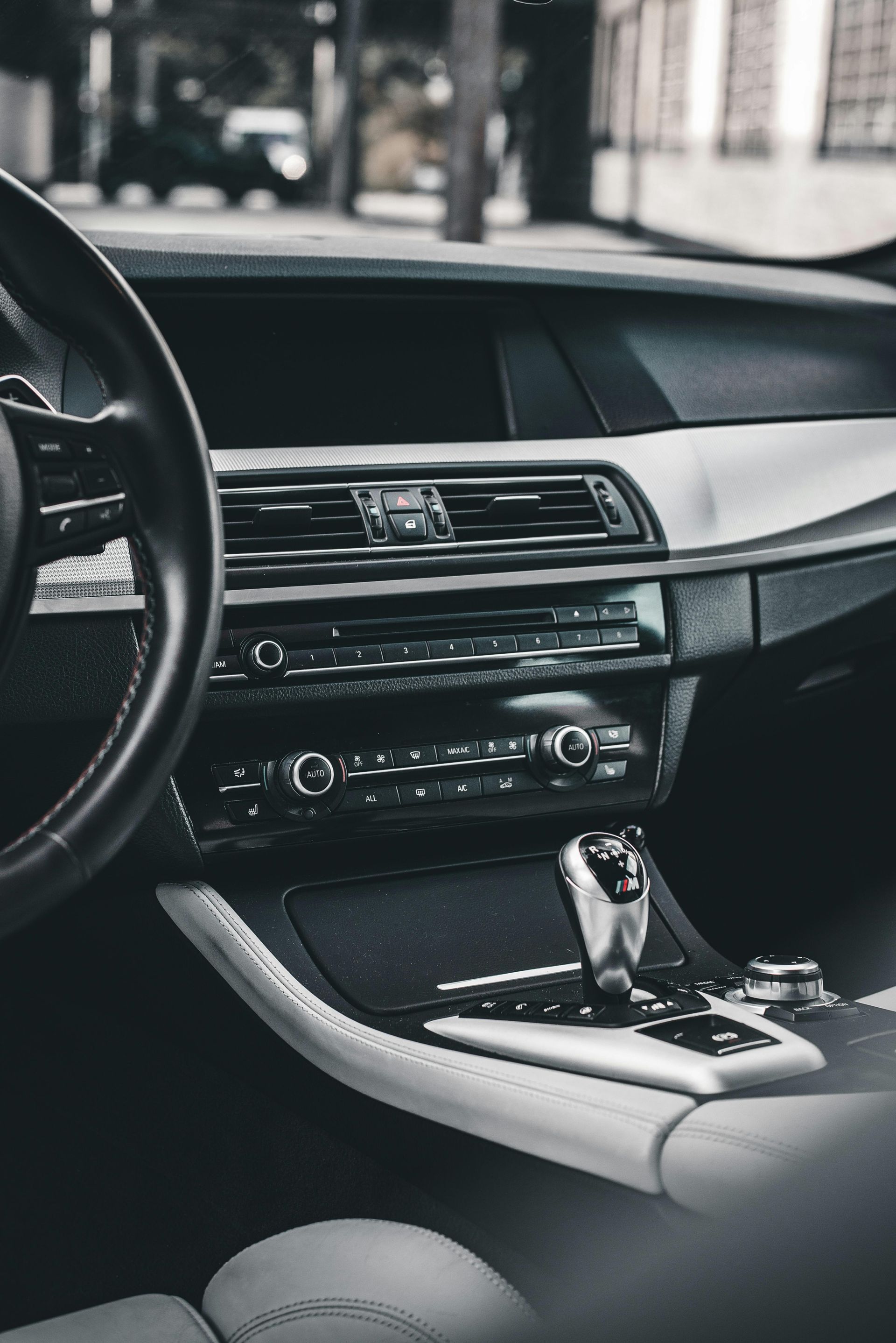 A black and white photo of the interior of a car