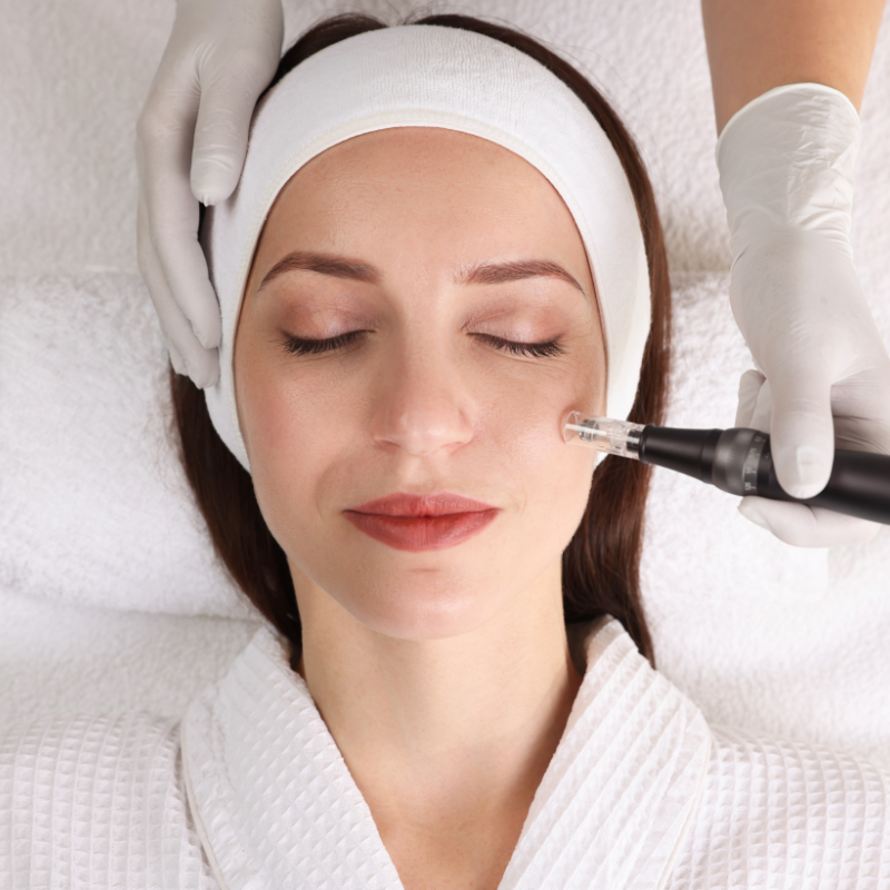 Glass of chia seed drink with lime and cinnamon sticks on a white table