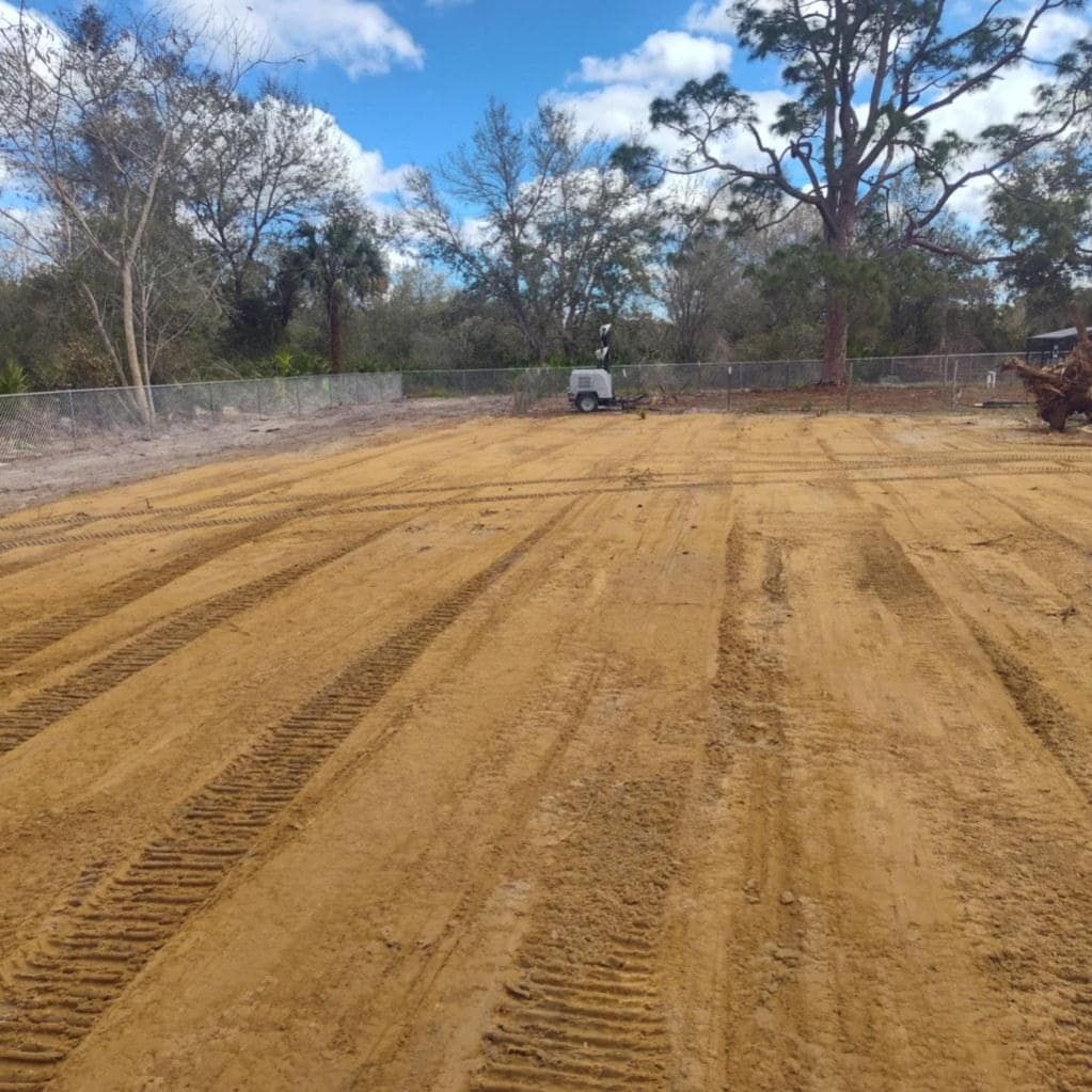 Debris cleanup after storm for a clear property lot.