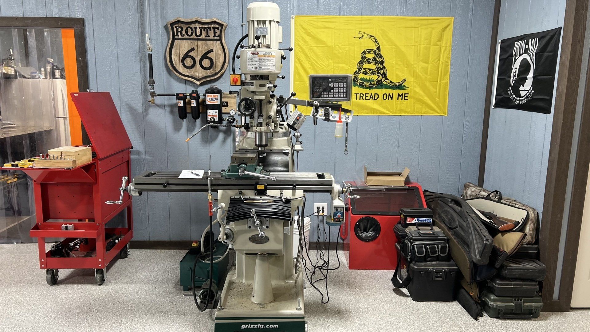 A machine is sitting in a room with a route 66 sign on the wall.