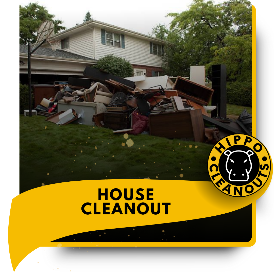 A pile of garbage in front of a house.
