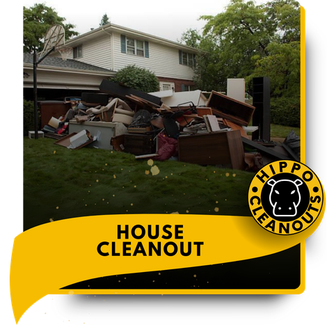 A pile of garbage in front of a house.