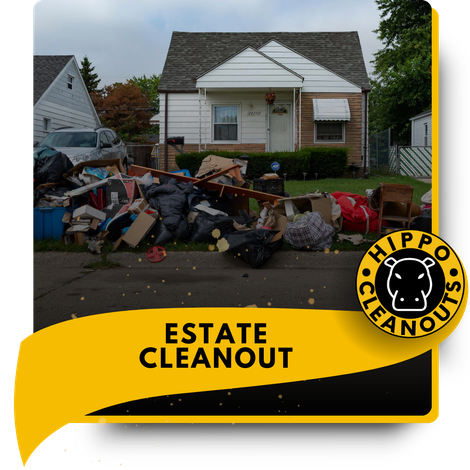 A pile of discarded materials in front of a house.
