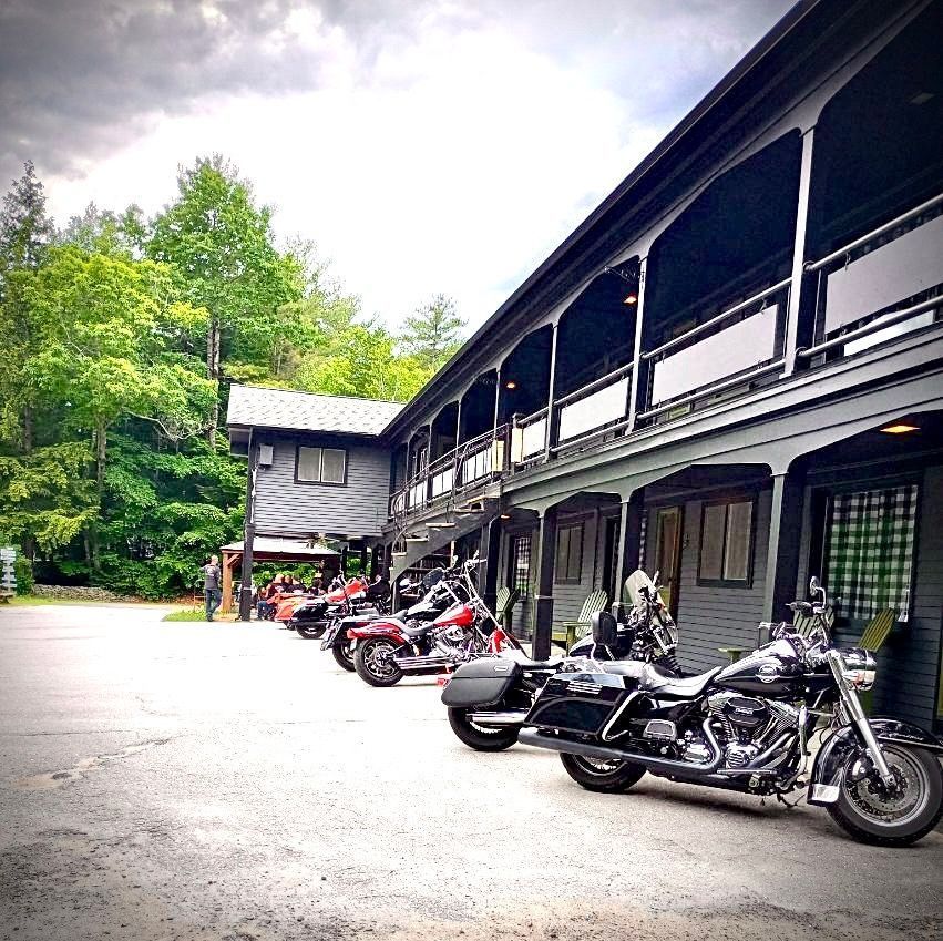 A row of motorcycles parked in front of a building