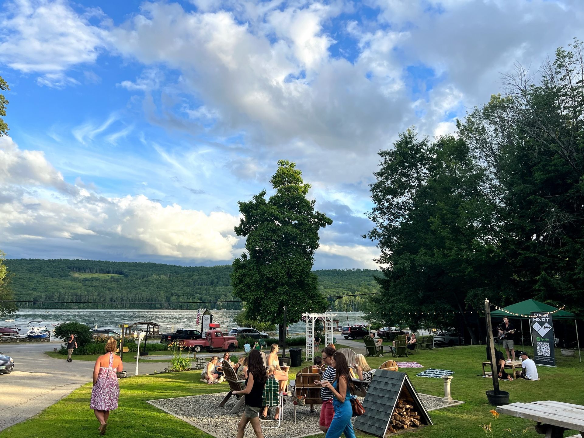 A view of a picnic area with a lake in the background