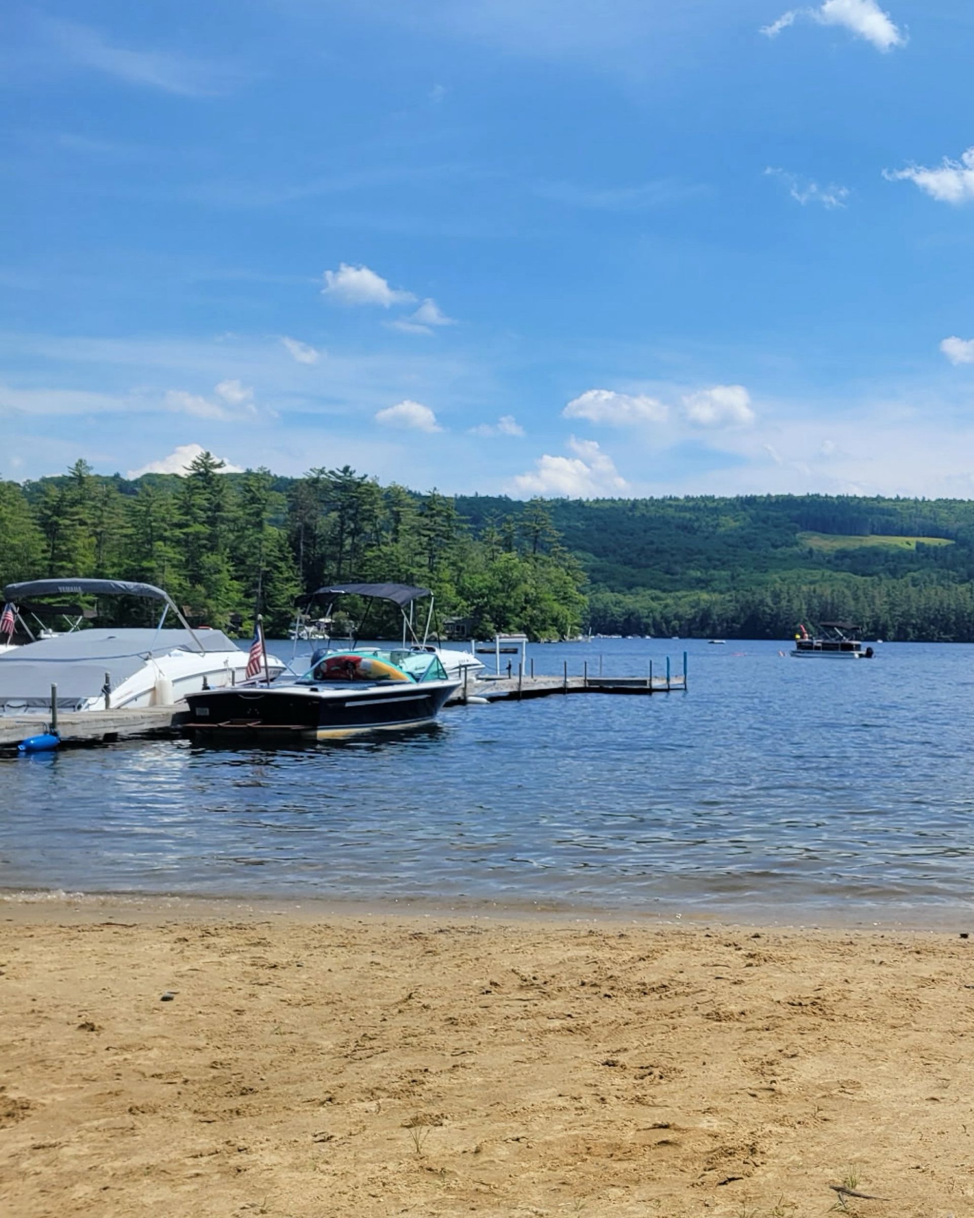 A person is sitting in a kayak on a lake.