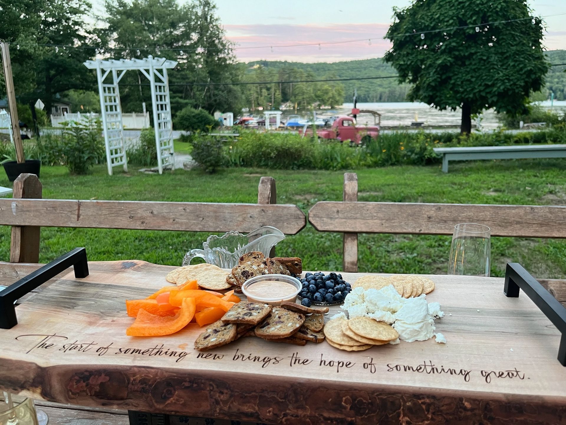A wooden table with a variety of food on it.