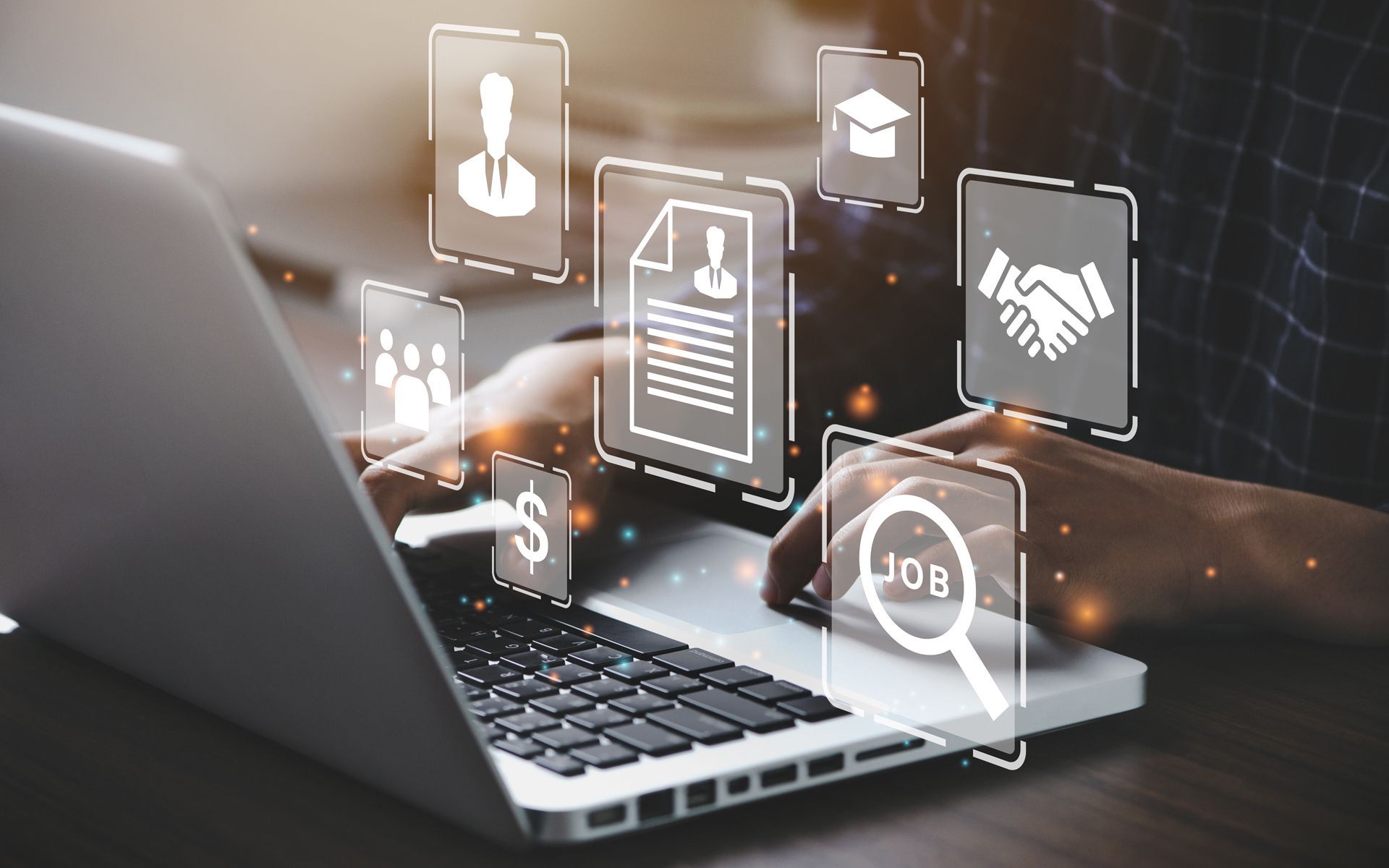 A Person is Typing on a Laptop Computer With Icons Coming Out of It