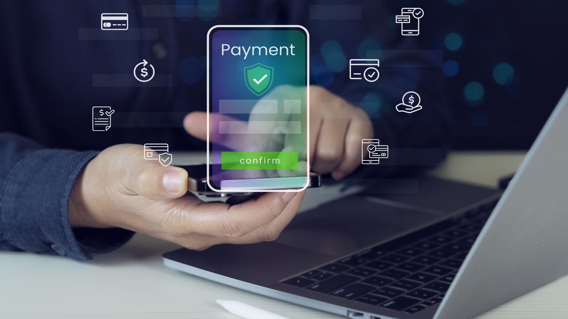 A Person is Holding a Cell Phone in Front of a Laptop Computer