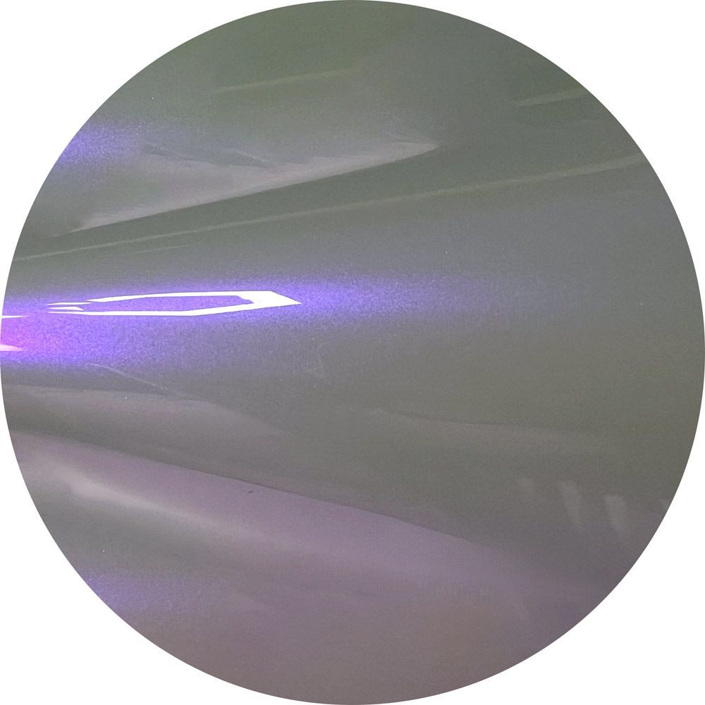 A close up of a purple circle with a white background