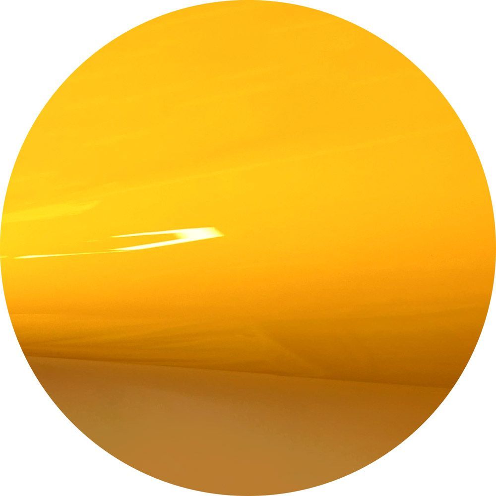 A close up of a yellow circle on a white background