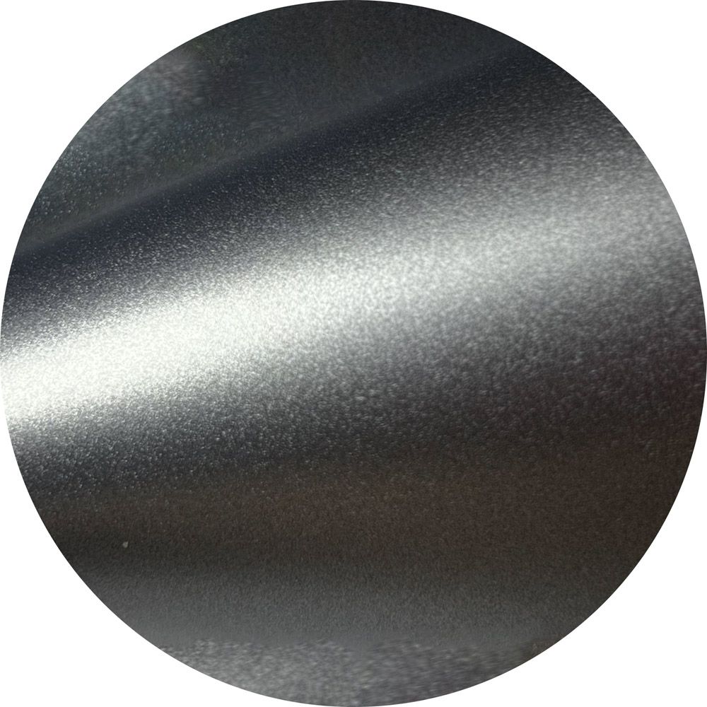 A close up of a metal surface in a circle
