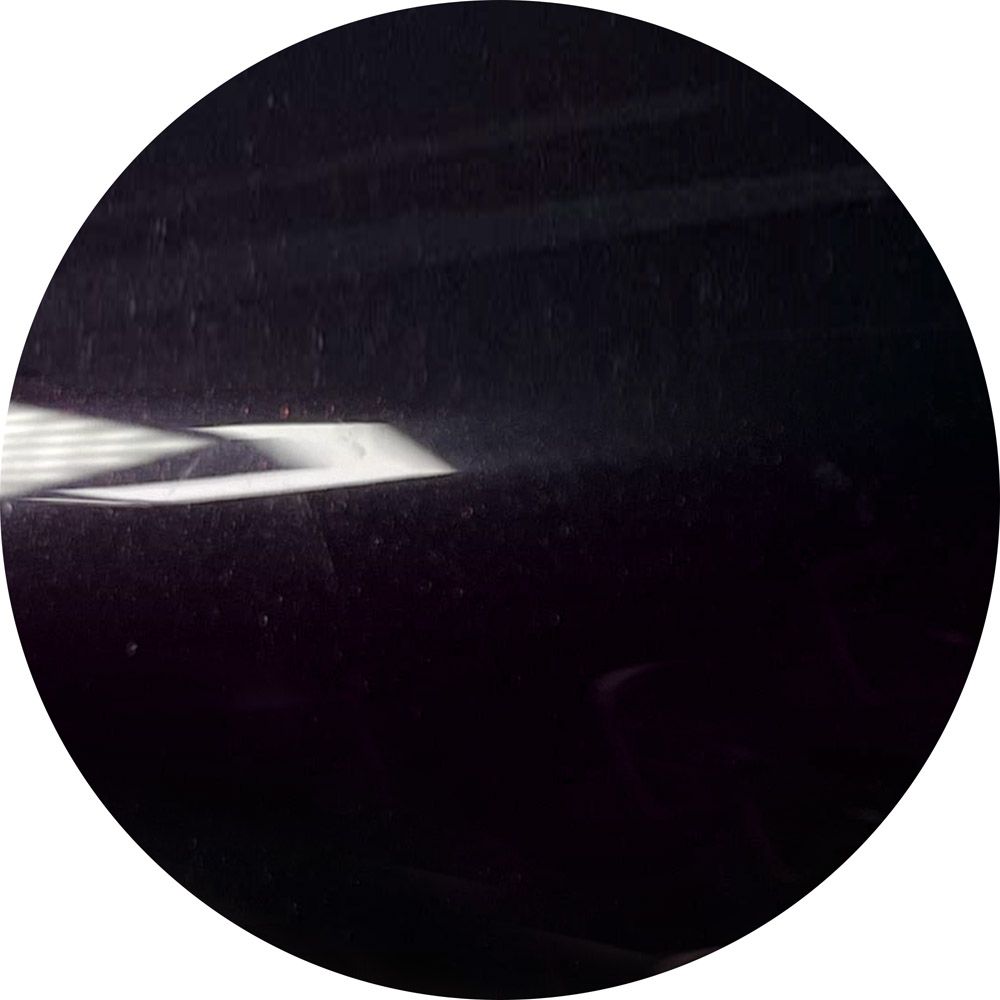 A black circle with a white line in the middle