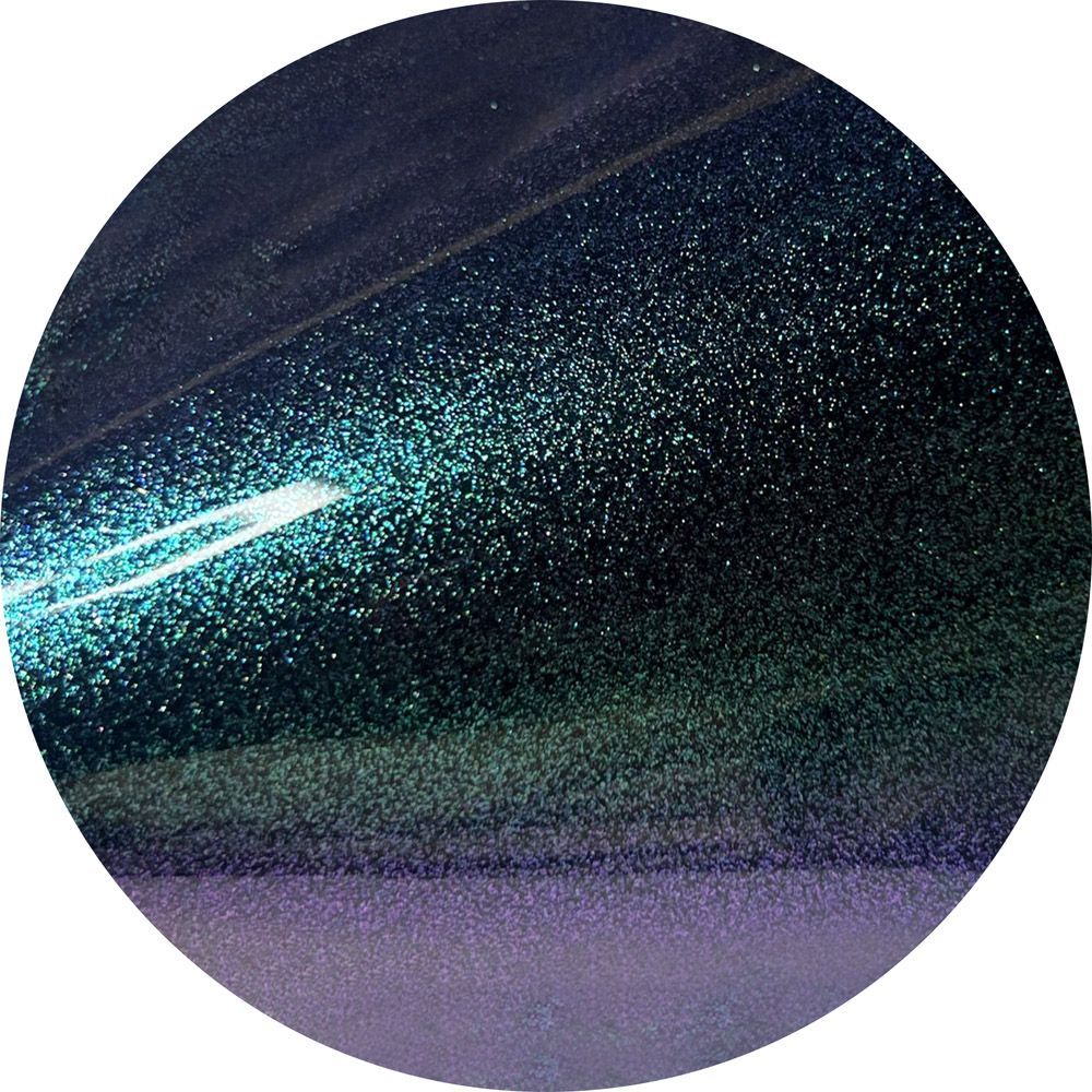 A close up of a purple and blue circle with glitter on it