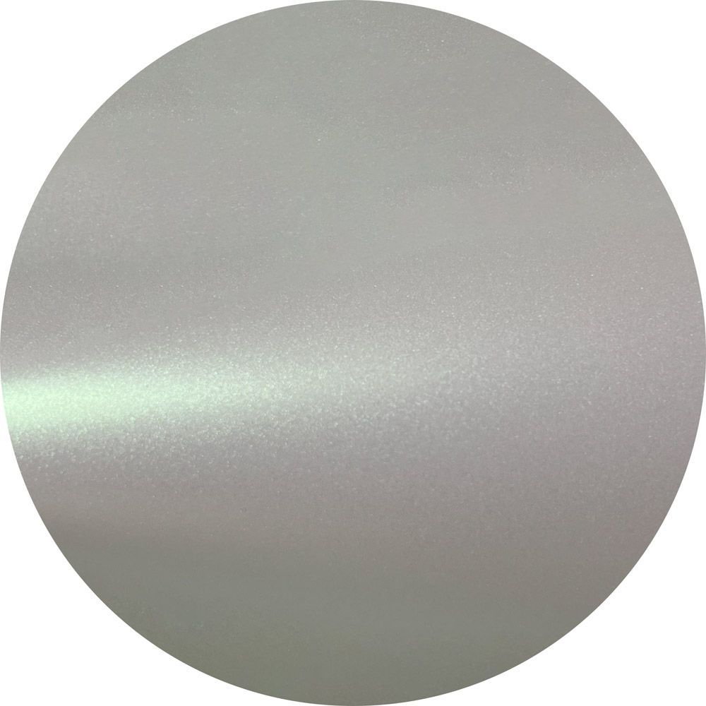 A close up of a silver circle on a white background