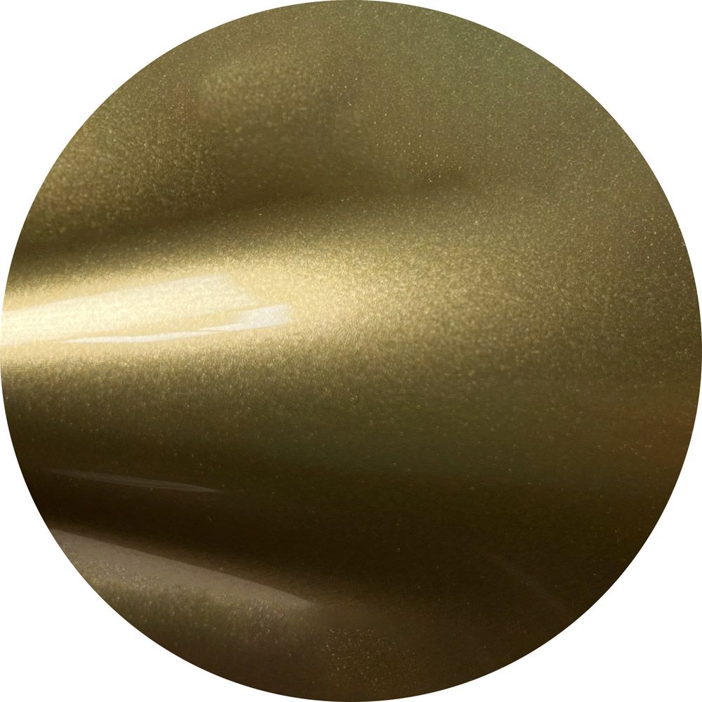 A close up of a gold circle on a white background