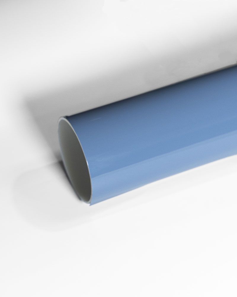 A tube of dolphin blue cppf wrap is sitting on a white surface.