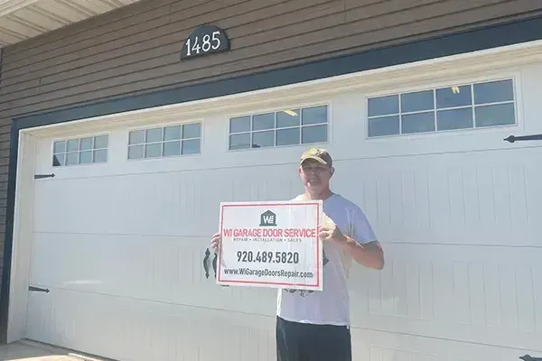A person holding a sign for 