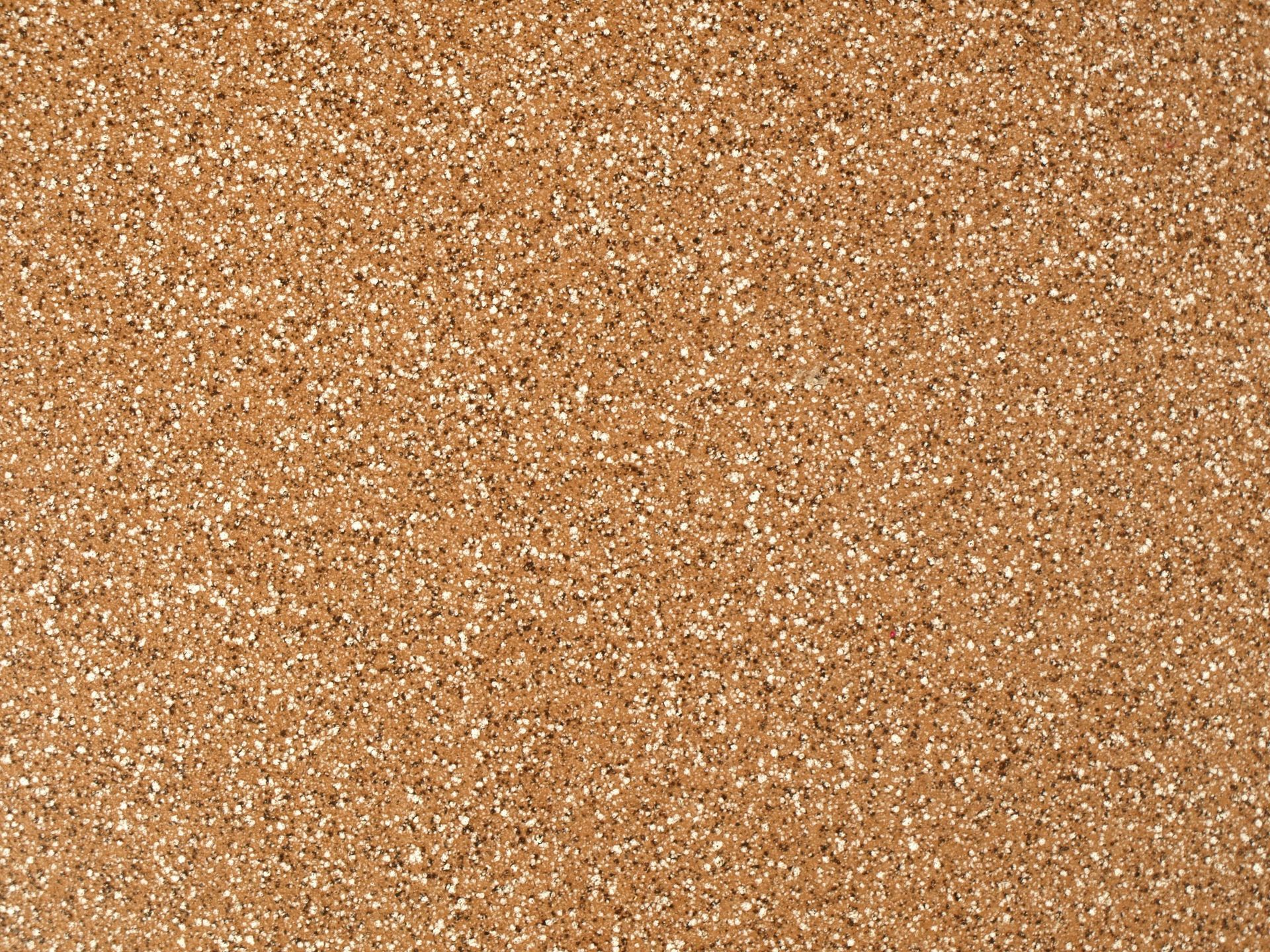 Corkboard, brown with small, light flecks throughout.
