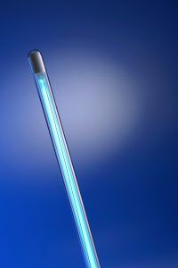 A close up of a blue light on a blue background.