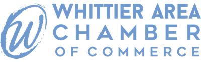 The logo for the whittier area chamber of commerce is blue and white.