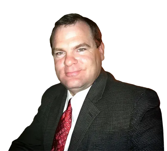 A man in a suit and tie is smiling for the camera