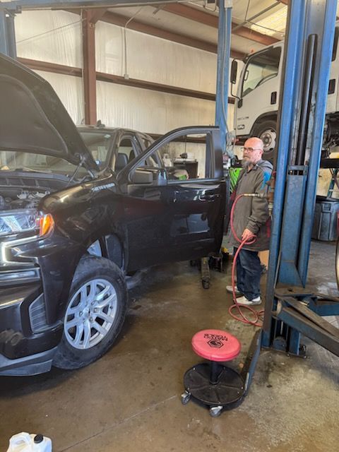 Our Certified Technician Checks Vehicle in Magnolia, TX - DK Auto & Diesel Services Inc.