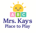 Logo for Mrs. Kays Place to Play: Smiling sun over alphabet blocks; dark blue text on white background.