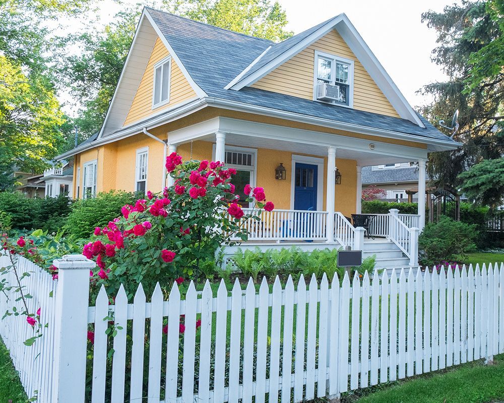 Beautiful house with a stylish fence, showcasing quality from a top fence company in Indianapolis, IN.