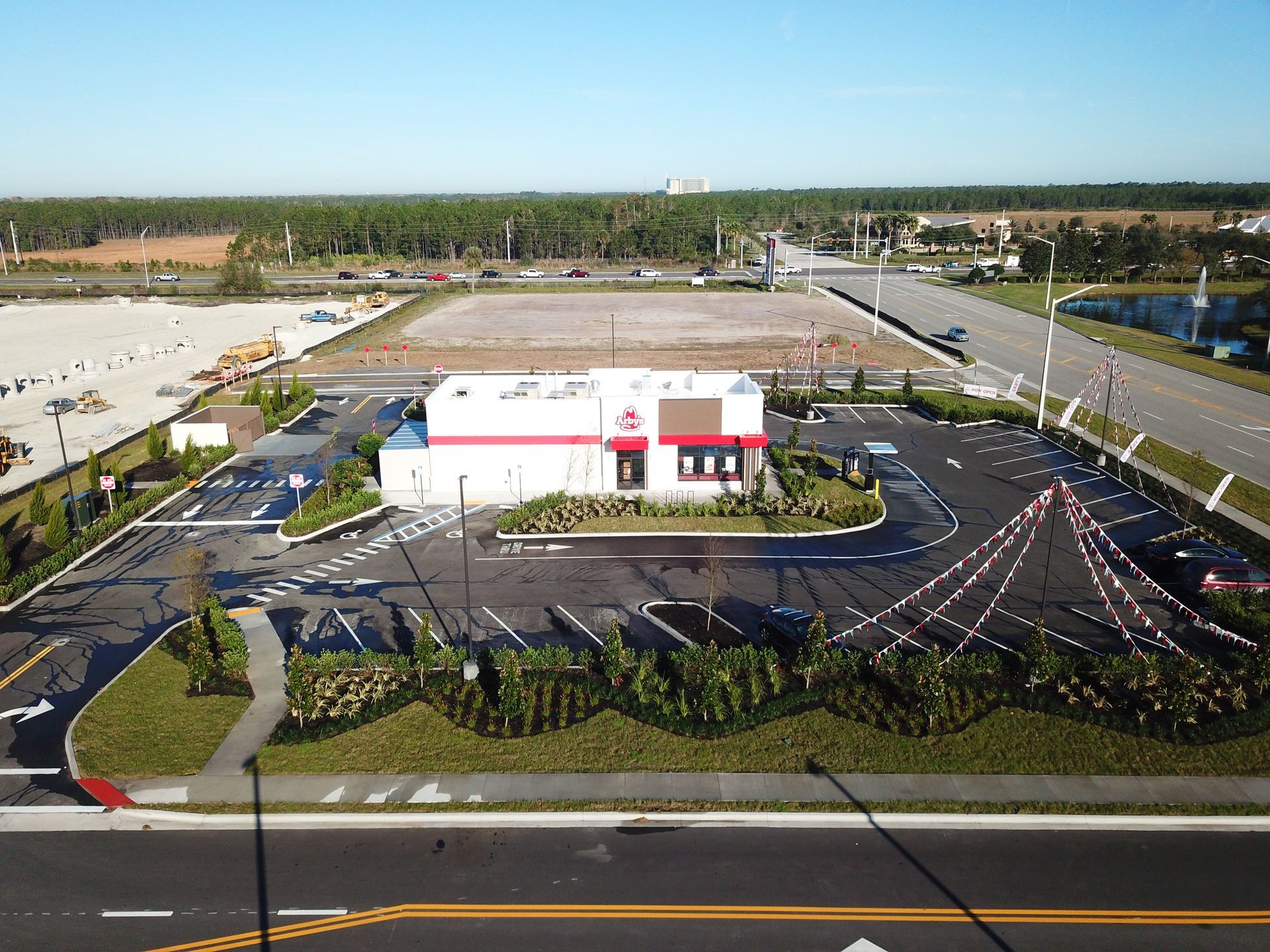 An aerial view of a fast food restaurant with a lot of parking