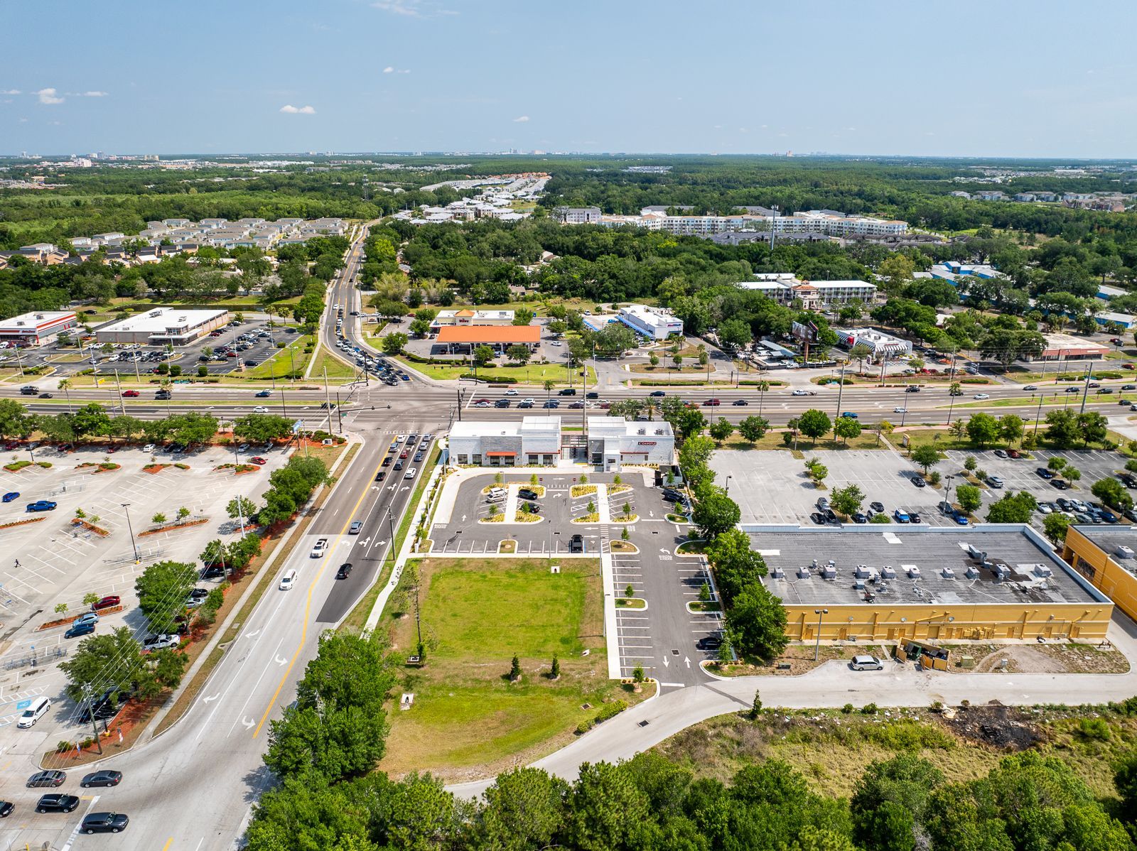 An aerial view of a city with a lot of buildings and trees.