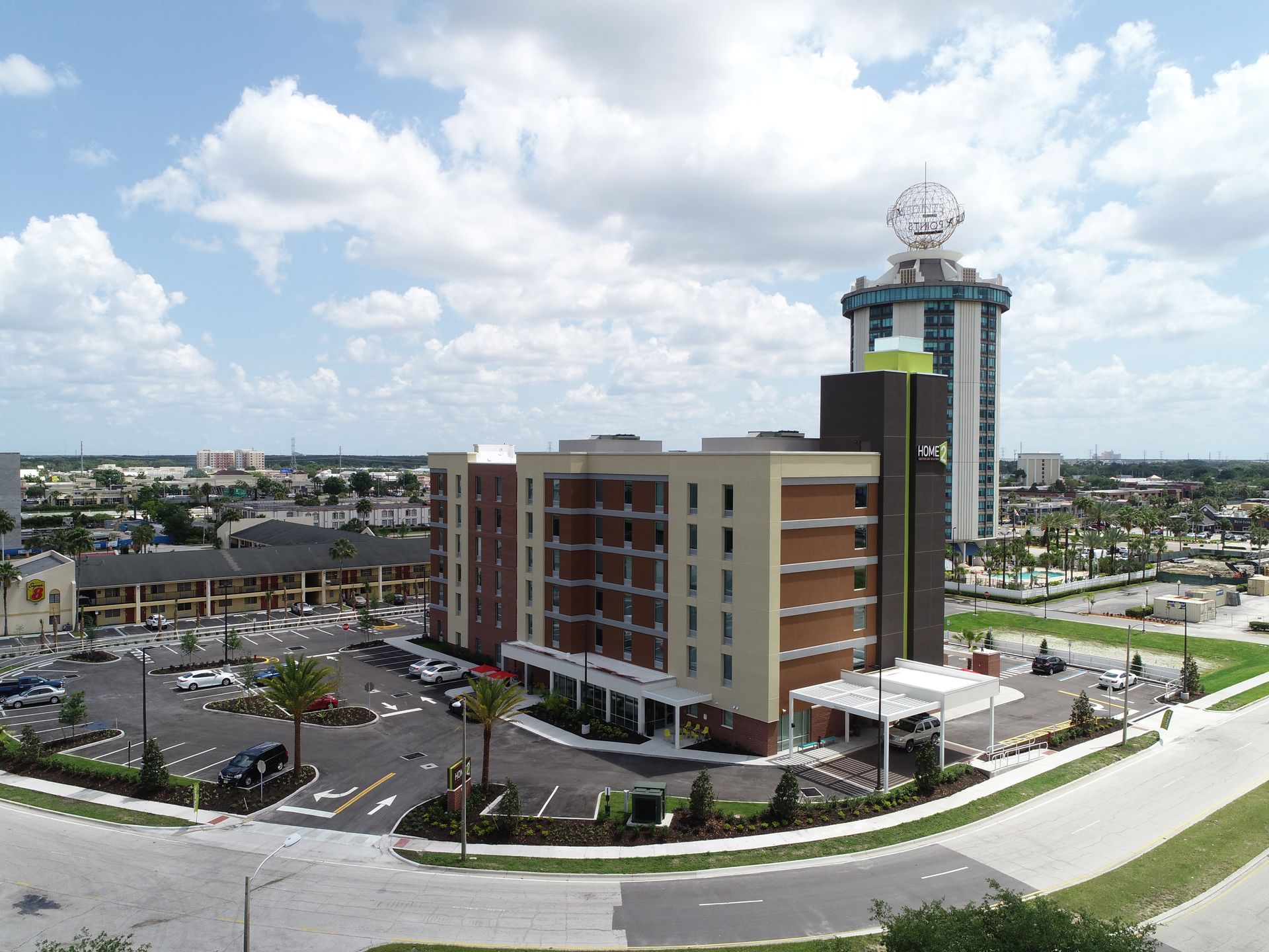 An aerial view of a large building with a clock on top of it