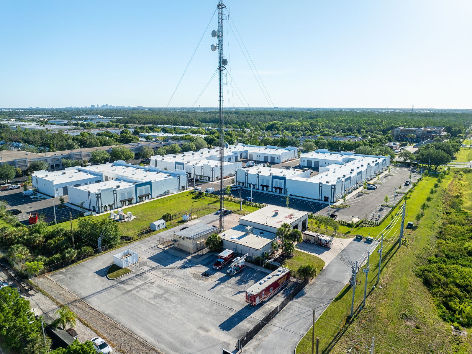 An aerial view of a large building with a tower in the middle of it.