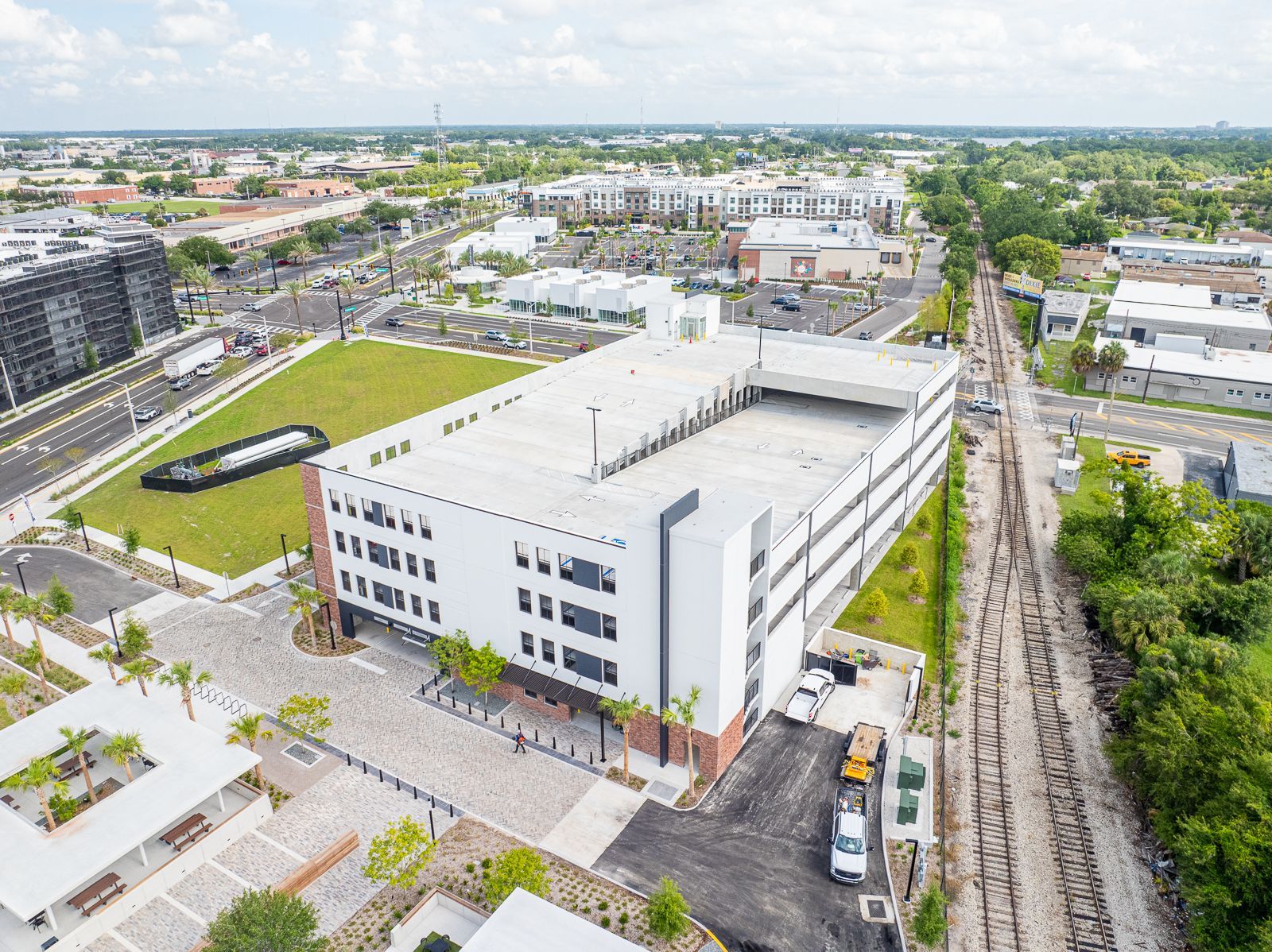 An aerial view of a large white building in the middle of a city.