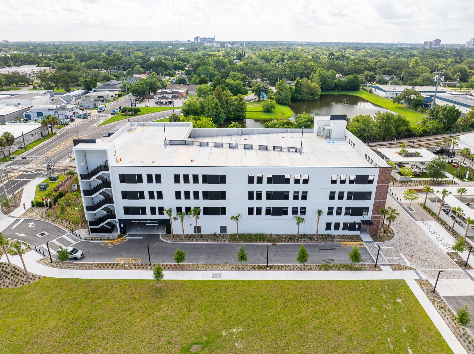 An aerial view of a large white building in a city