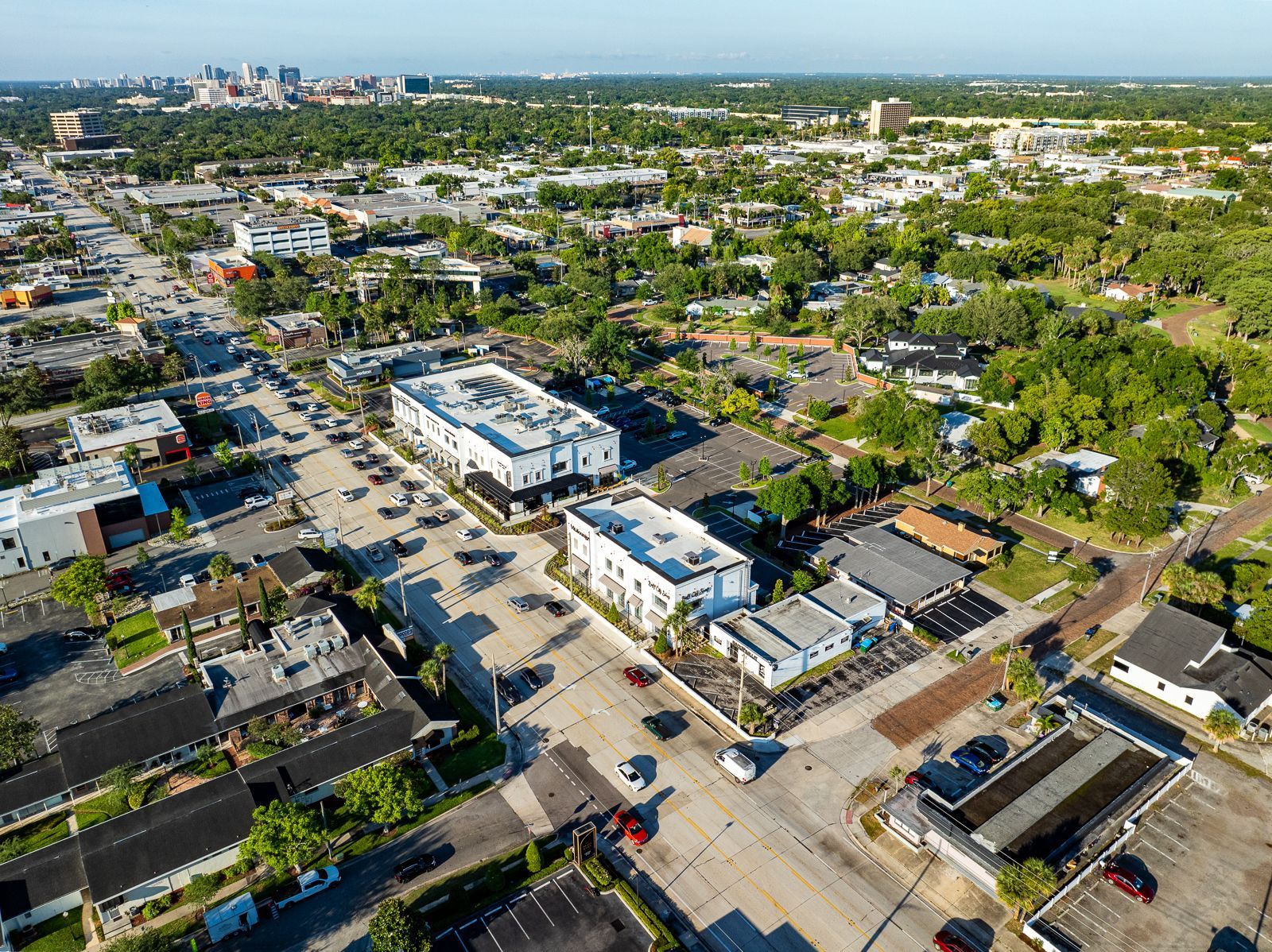 An aerial view of a city with lots of buildings and trees.