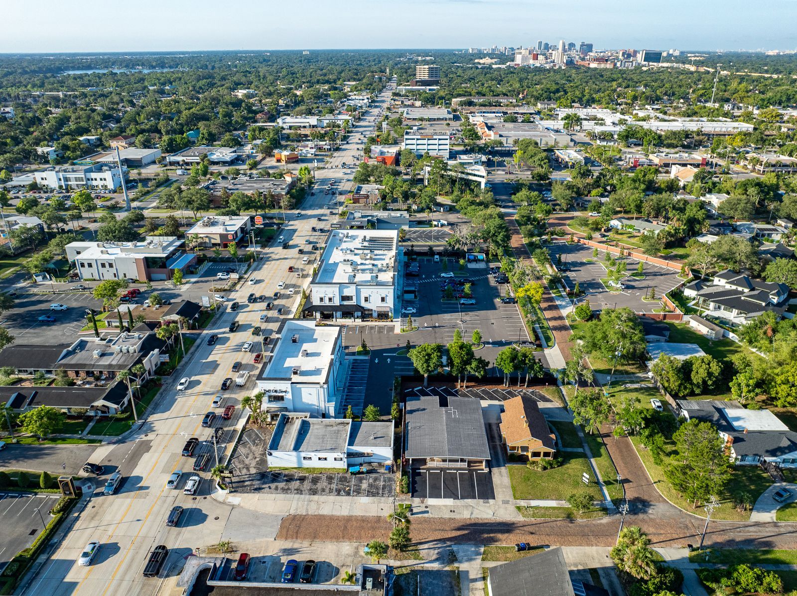An aerial view of a city with lots of buildings and trees.