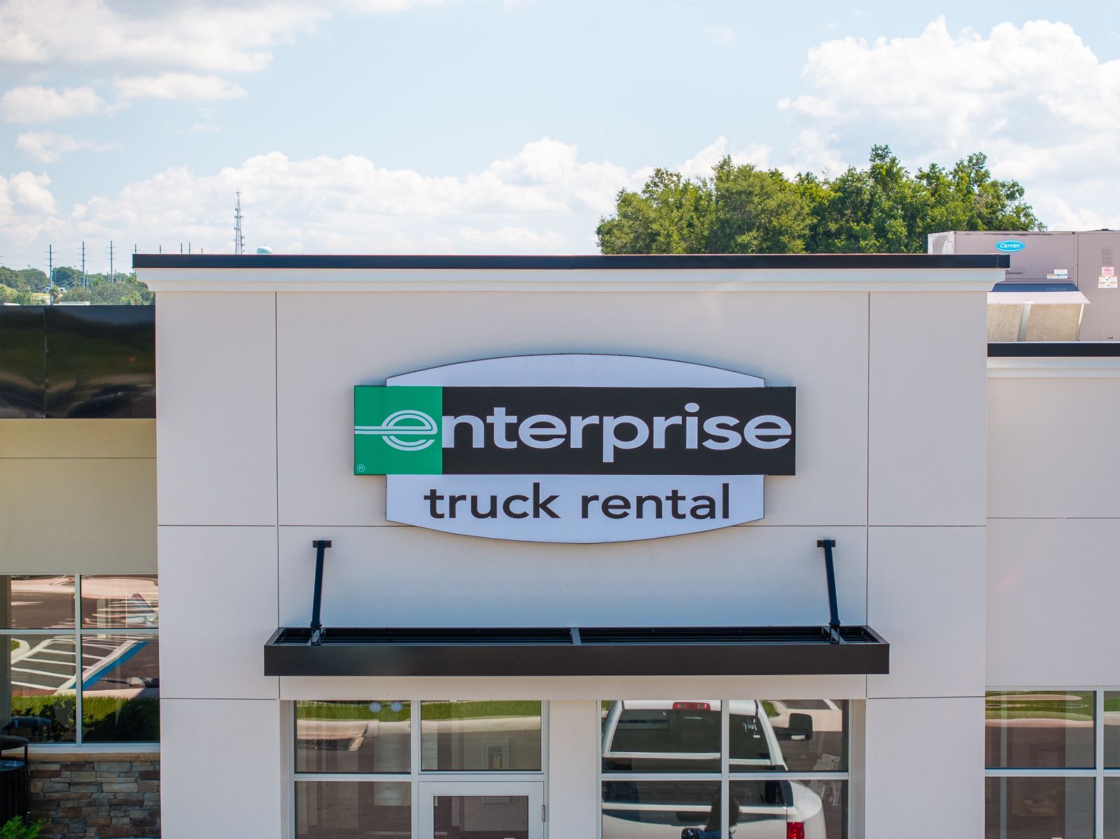 Enterprise truck rental is located on the side of a building