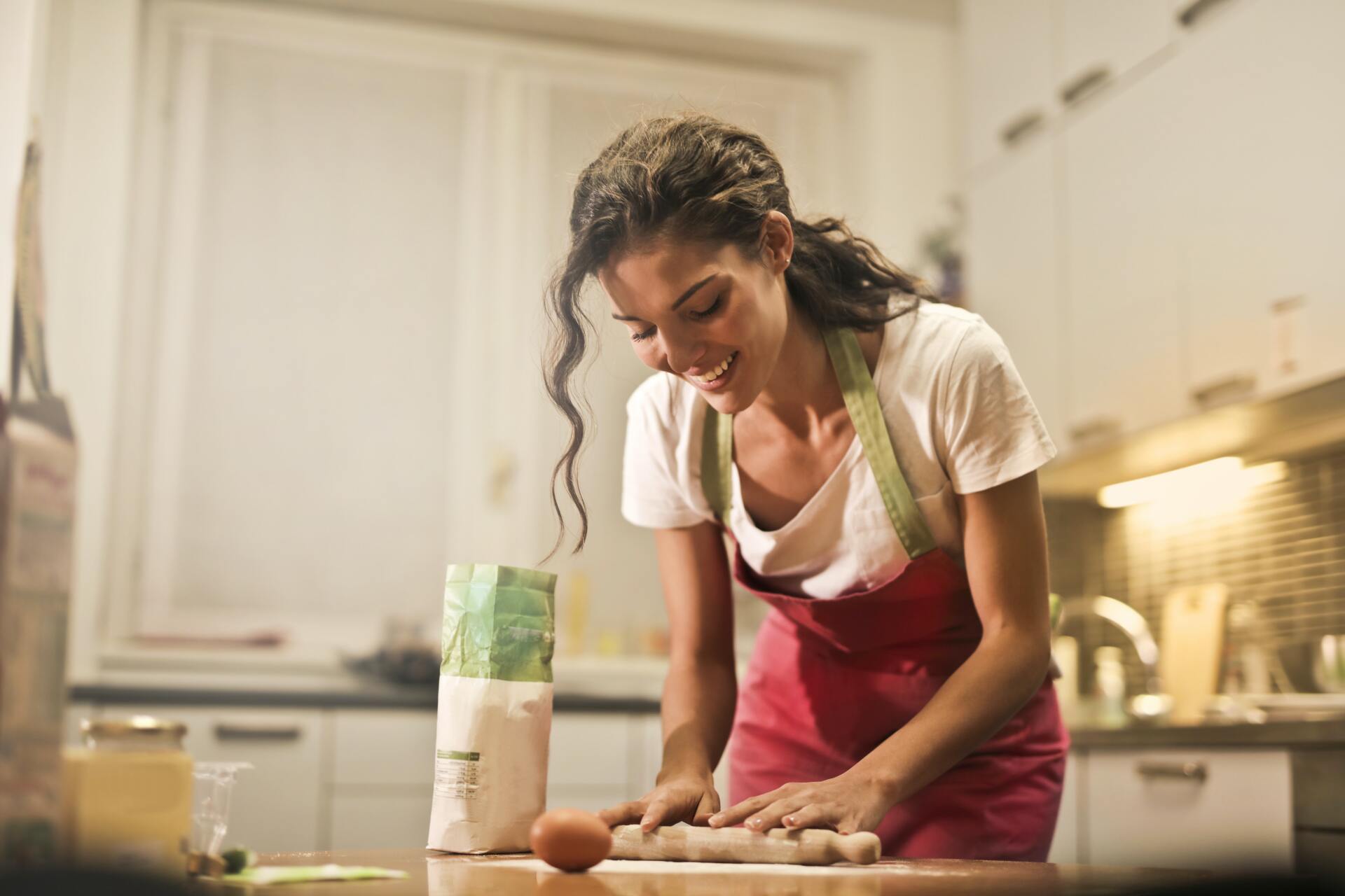 woman preparing food after kitchen remodeling