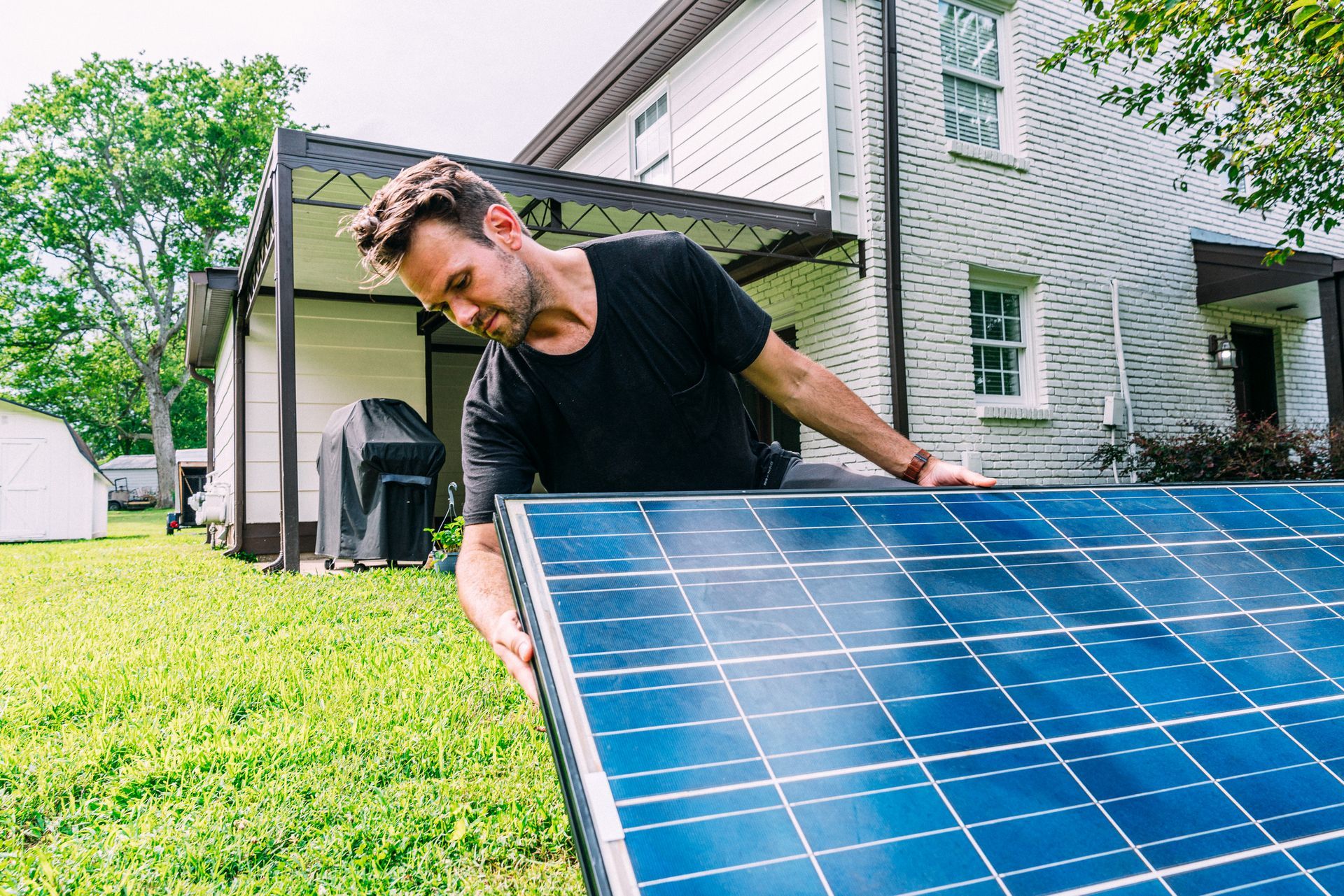 A technician inspecting a pool solar system. A technician inspecting a pool solar system.