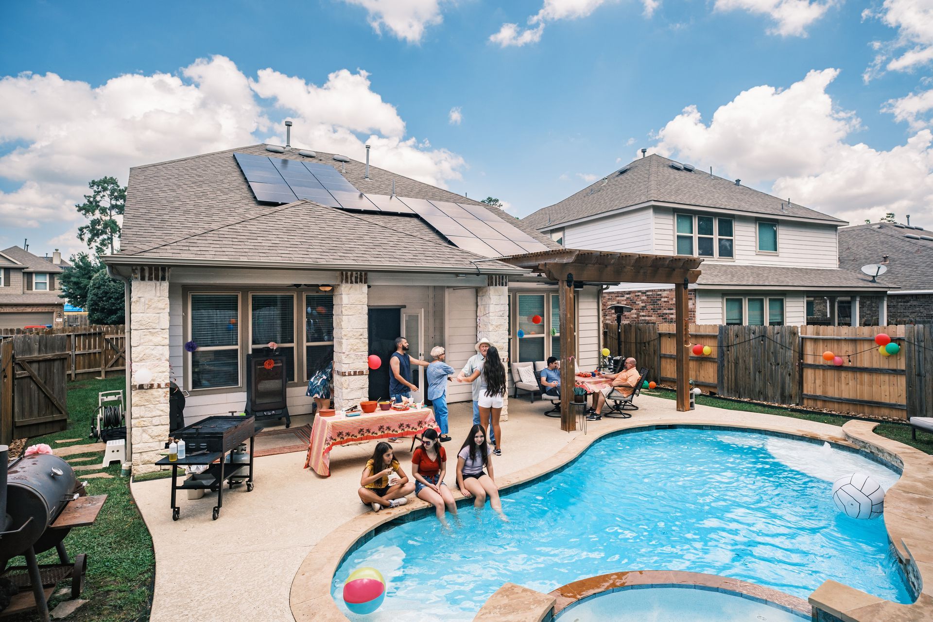 Picture of a family having a party in their pool area Picture of a family having a party in their pool area