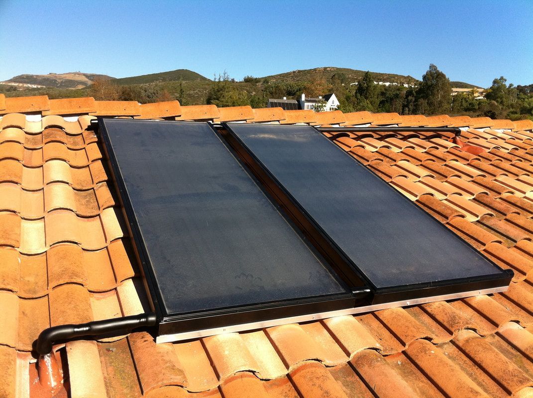 A solar panel is sitting on top of a tiled roof — San Diego, CA — Mark Naylor Solar Specialists