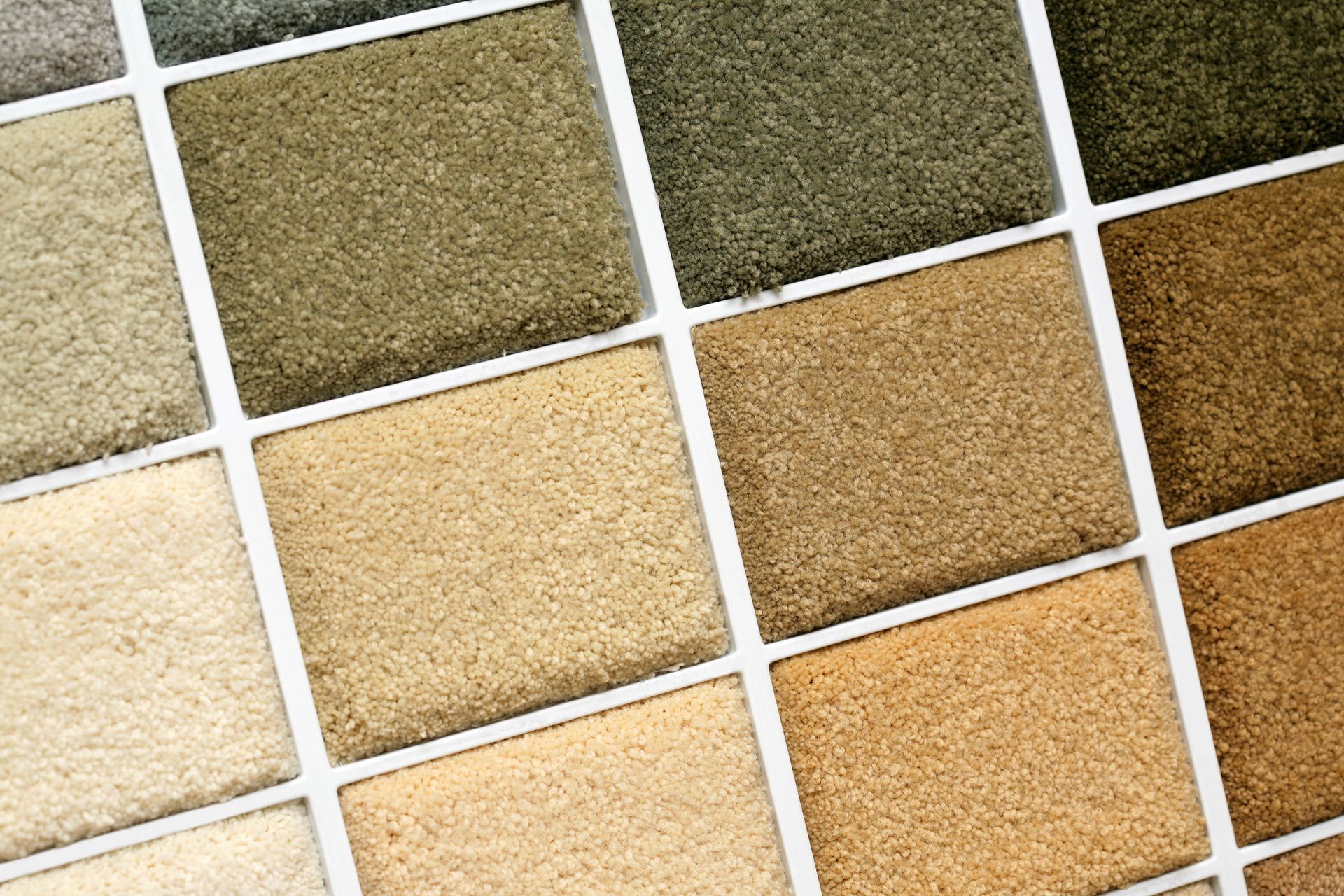 Carpet color samples in various neutral tones displayed in a grid.